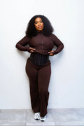 Steel bone waist trainer worn with brown sauna suit - front view
