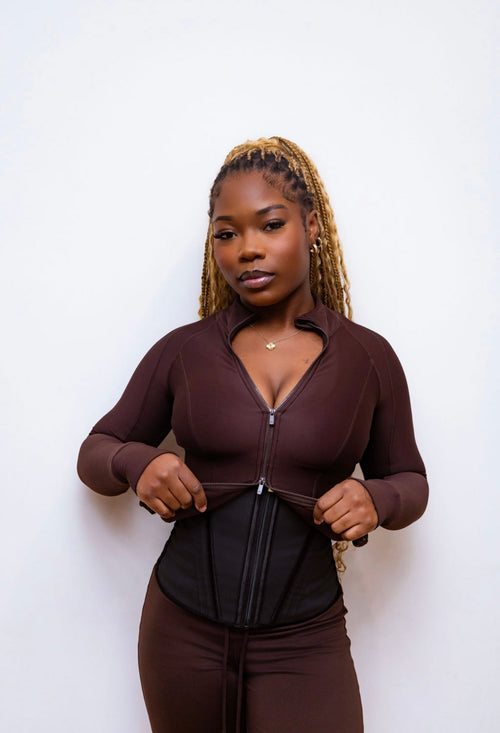 Model wearing Steel Bone Waist Trainer — close-up front view showing waist compression and hourglass shape